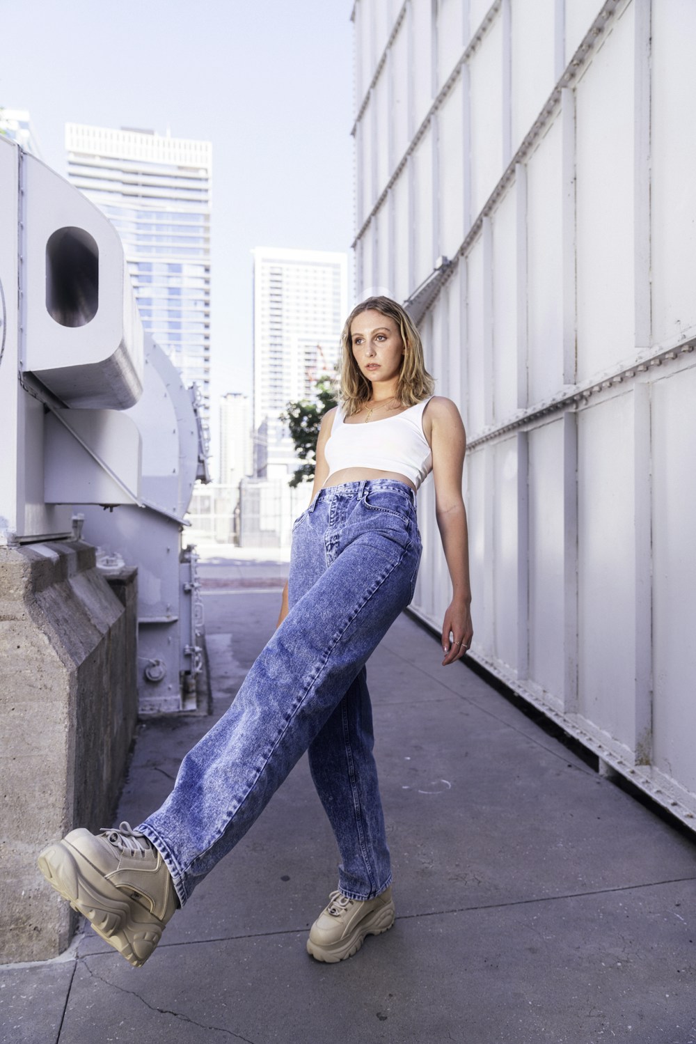 Woman in a white top and jeans